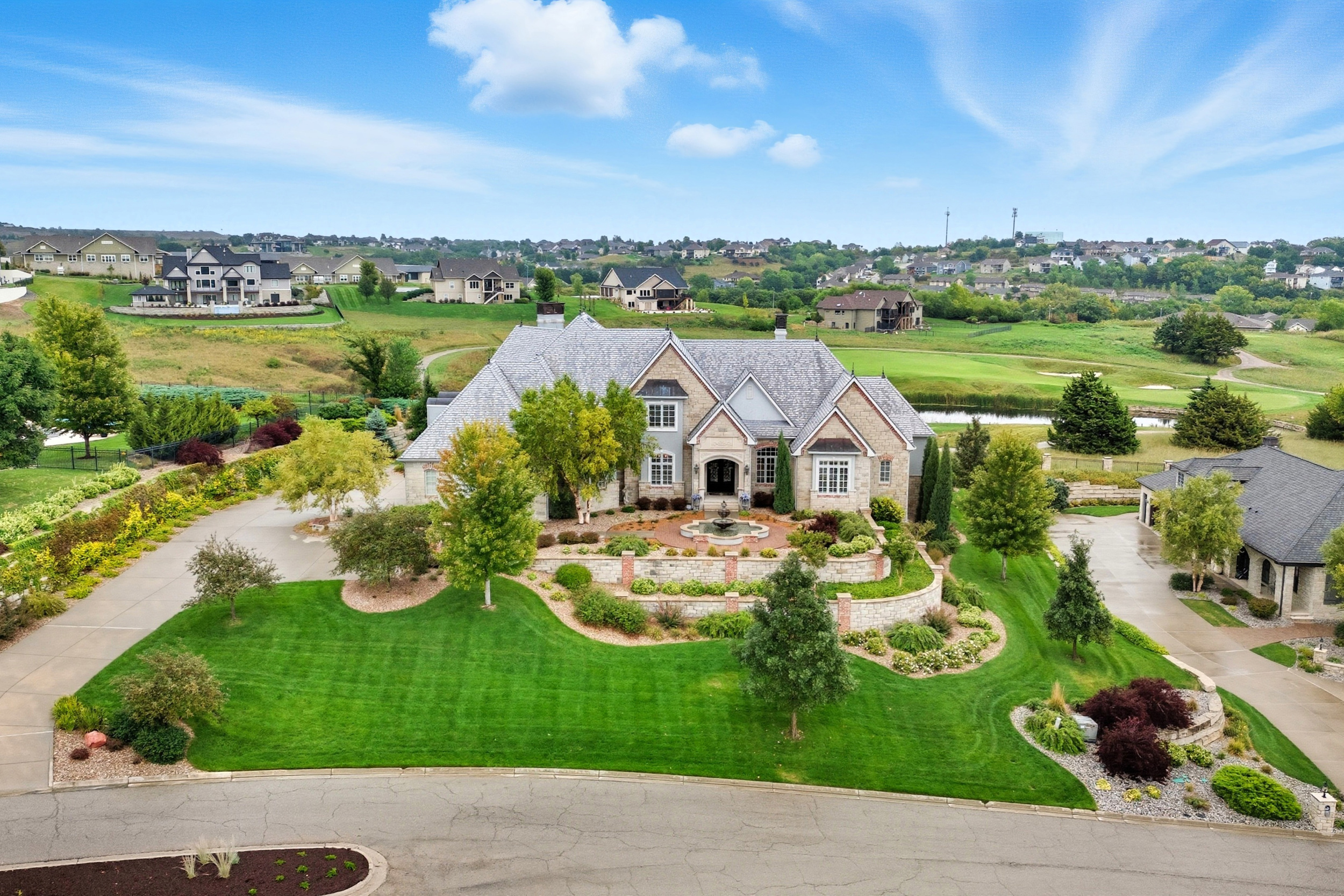 A stunning aerial drone shot of a property at sunset.
